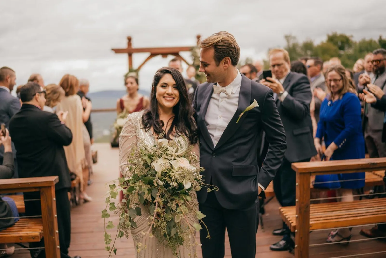Couple walking the aisle after their Windham Mountain wedding ceremony