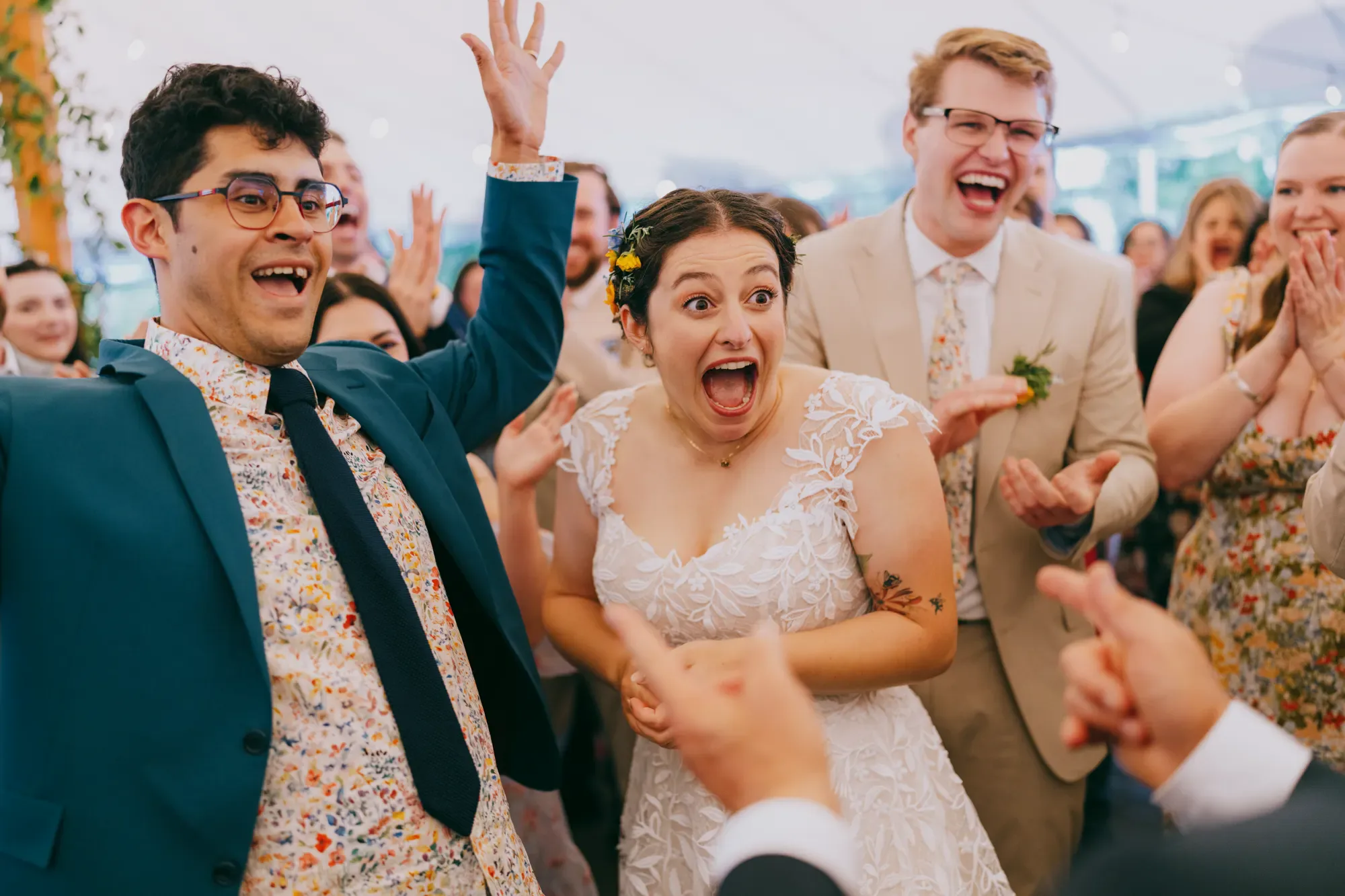 Joyful bride and groom celebrating with family during wedding reception at Blooming Hill Farm in the Hudson Valley