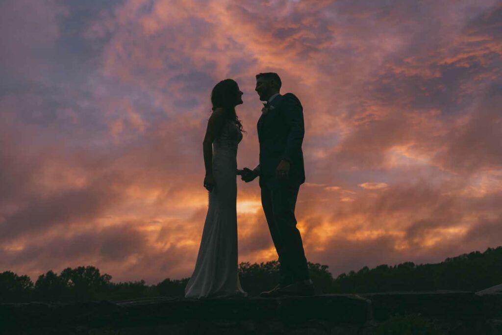 Couple silhouette at sunset wedding photography.