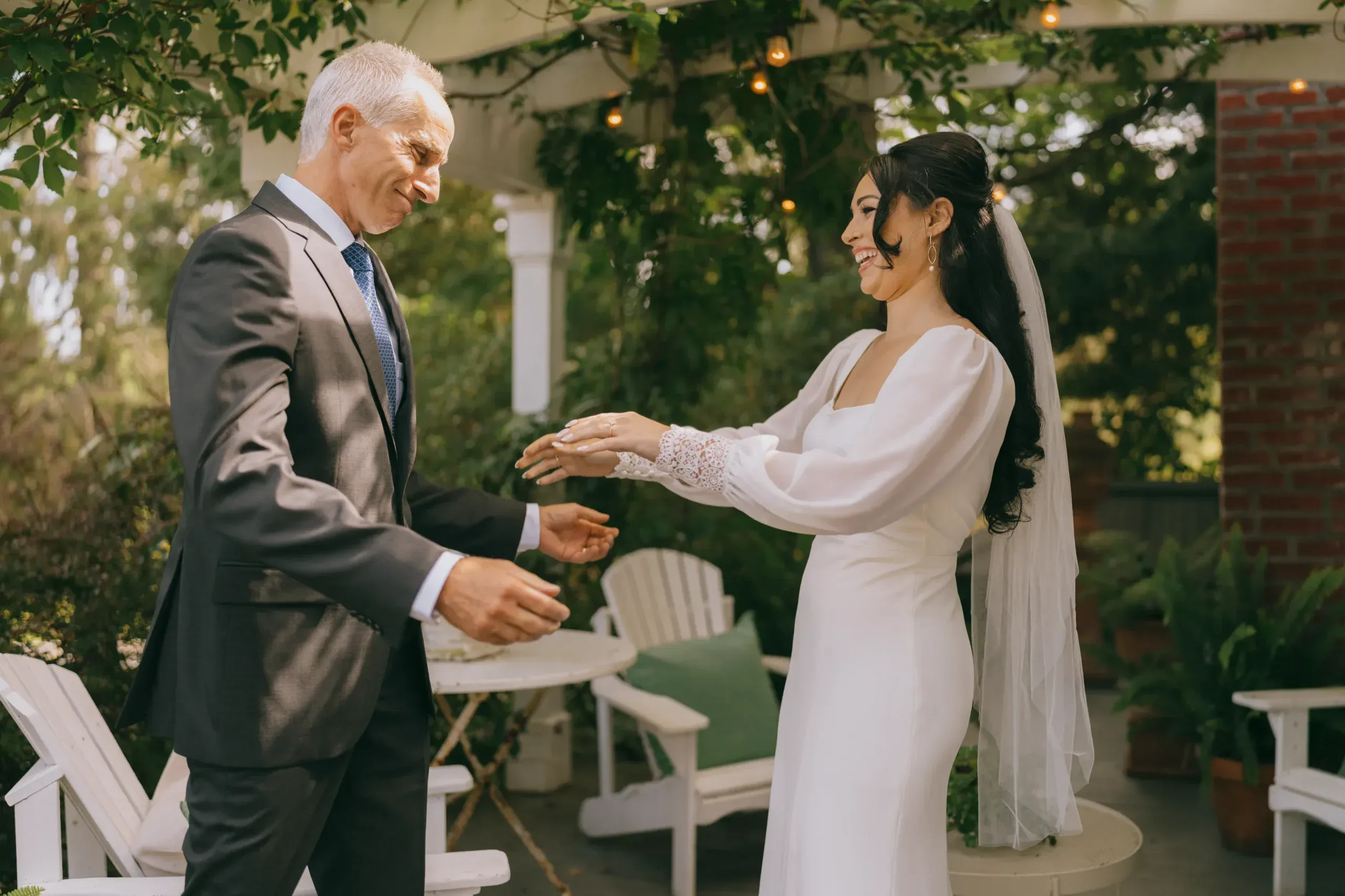 Father escorting bride at an outdoor wedding